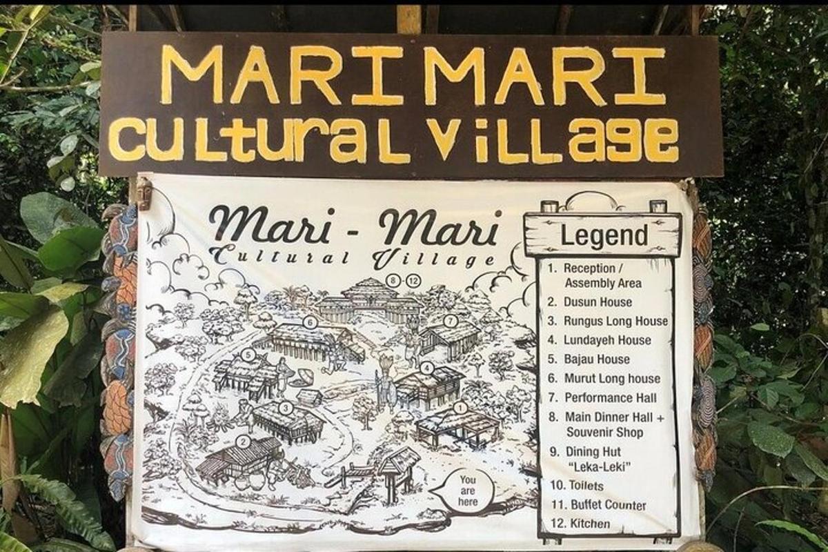 a sign for a marmite cultural village in a park