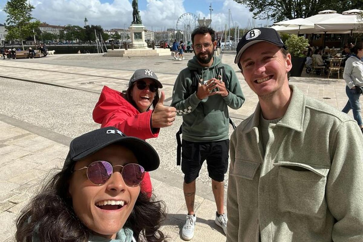 a group of people posing in front of a statue