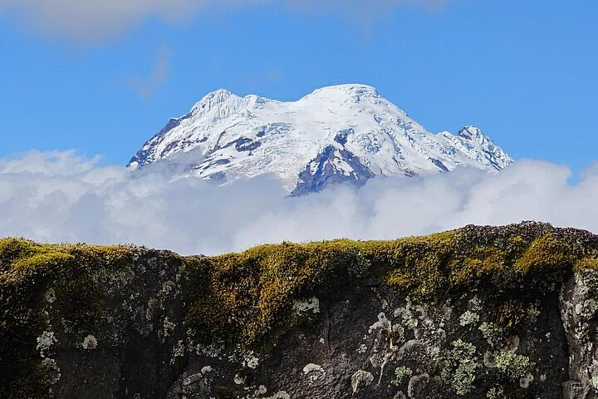a snow covered mountain sitting on top of a mountain