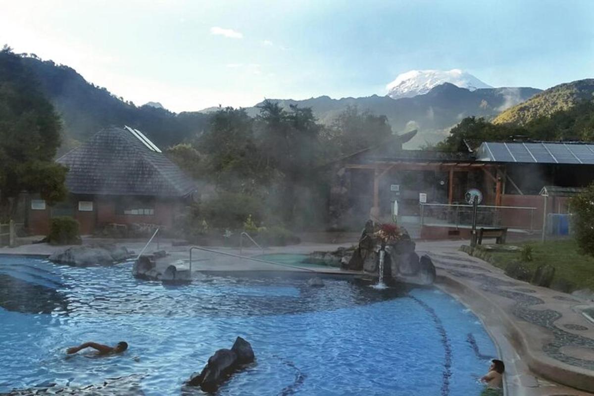 a pool of water with people swimming in it