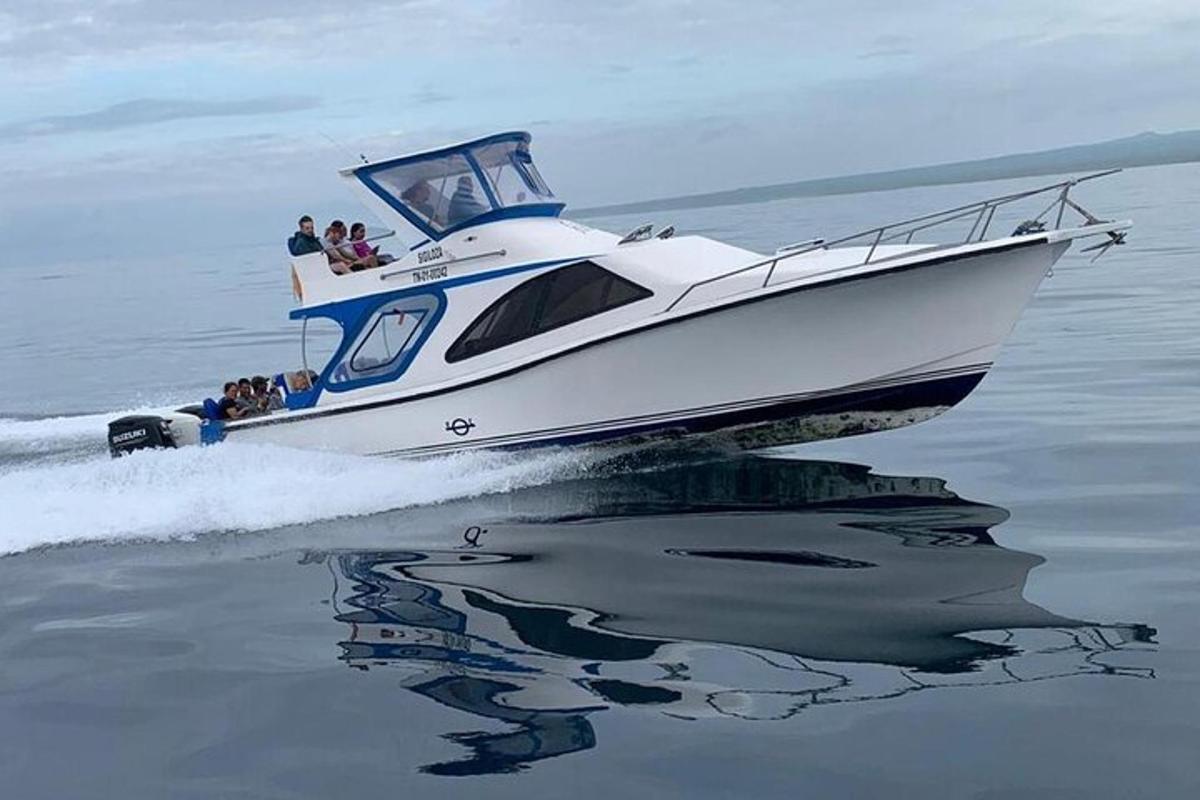 a boat in the water with people on it