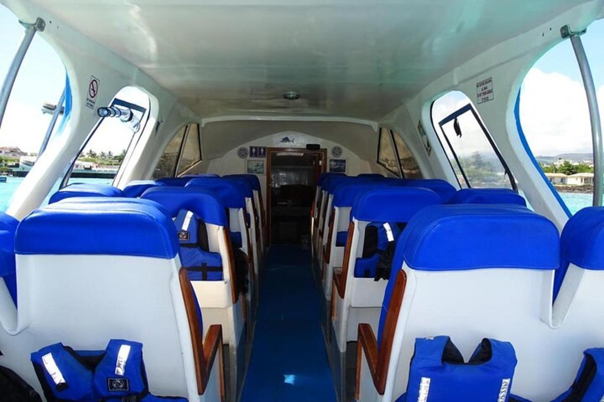 an empty bus with blue and white seats