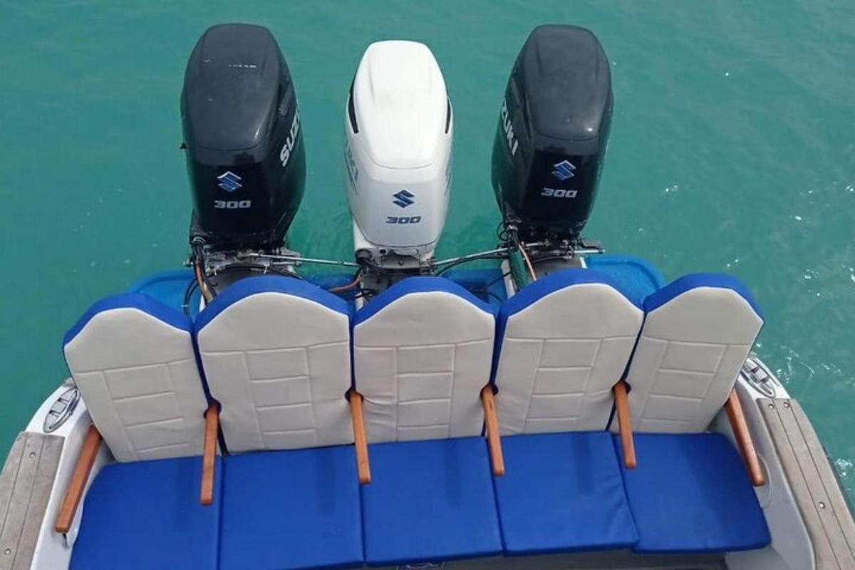 two engines on the back of a boat in the water