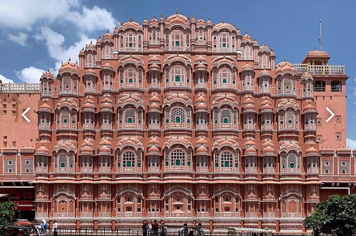a large pink building with a large palace