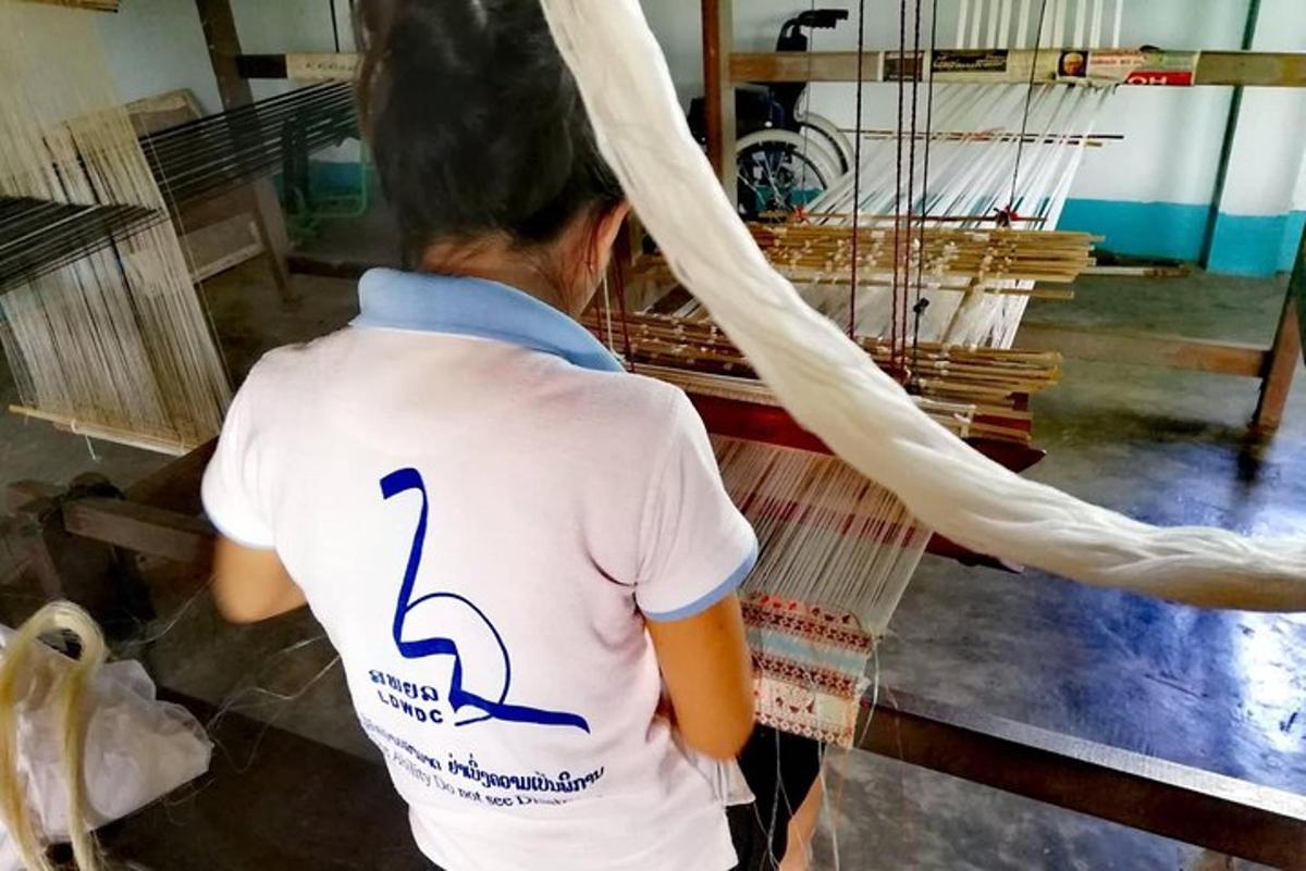 a woman is standing in a room with a rope
