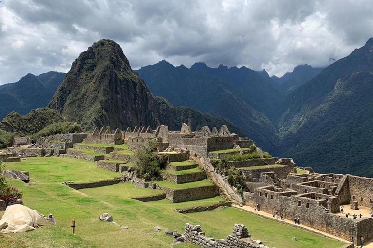 an ancient ruins with a mountain in the background