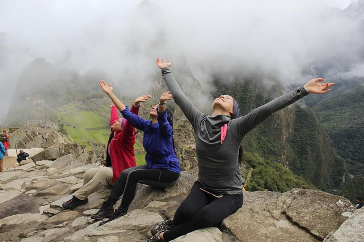 a group of people sitting on top of a mountain
