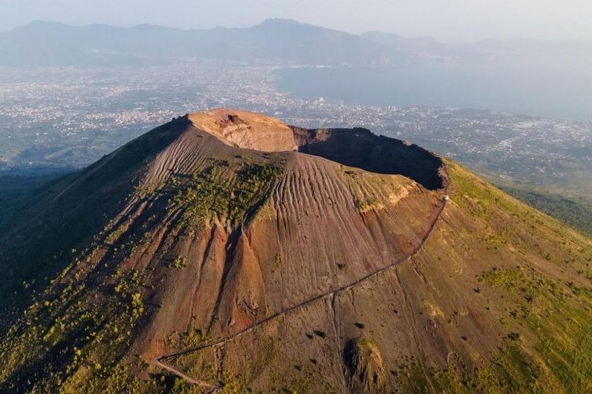 an aerial view of a mountain with a town