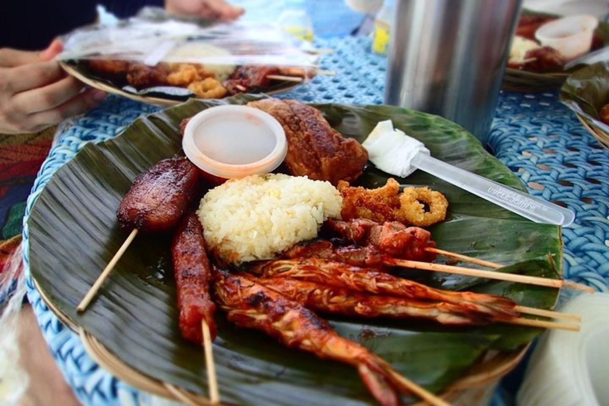 a plate of food with meat and rice on a table