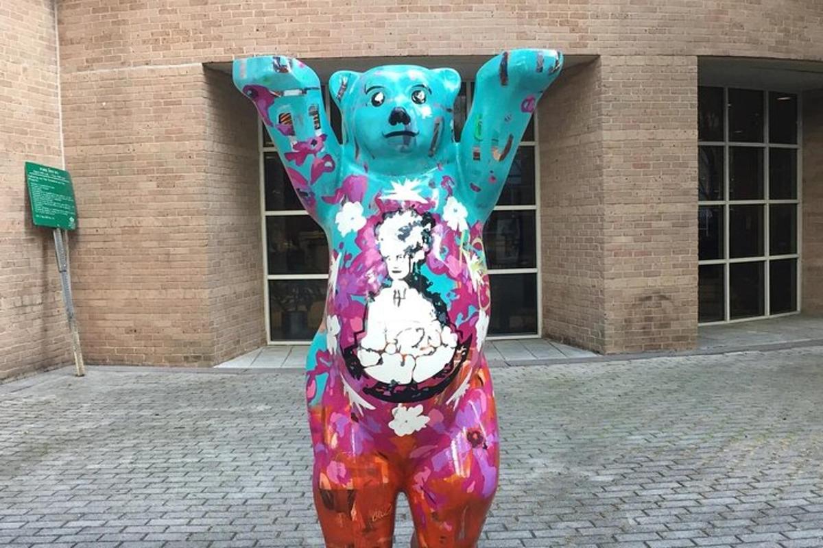 a bear statue in front of a building