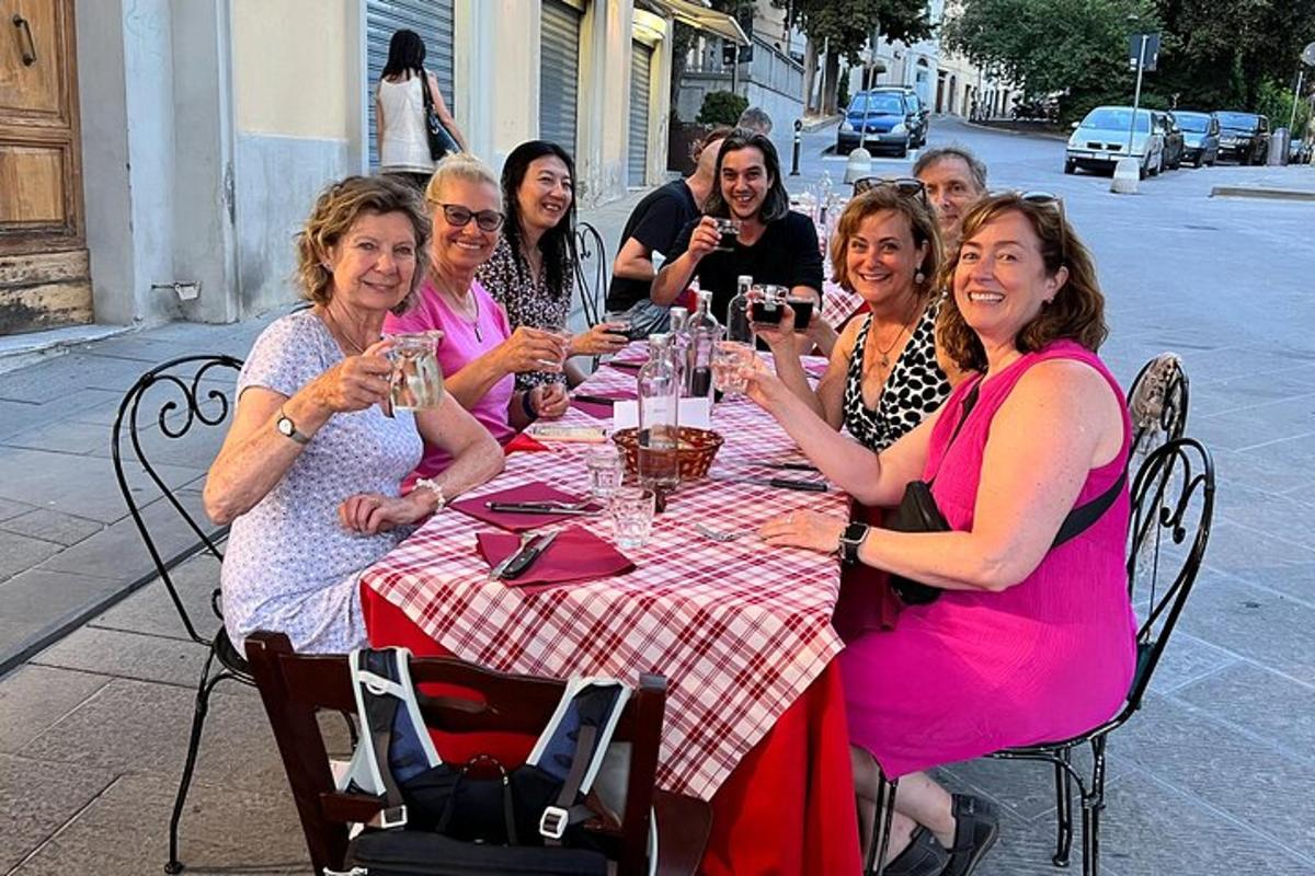 a group of women sitting at a table drinking wine