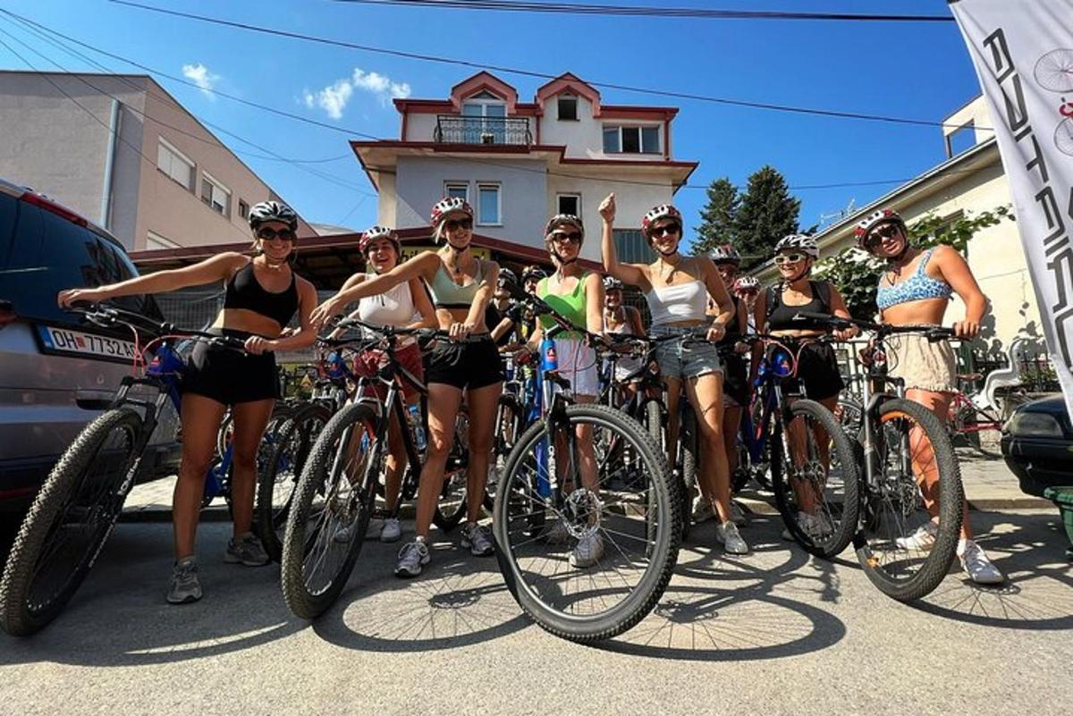a group of women in bathing suits posing with their bikes
