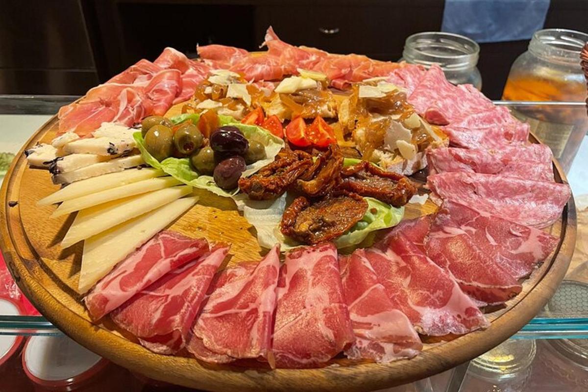 a large platter of meats and vegetables on a table