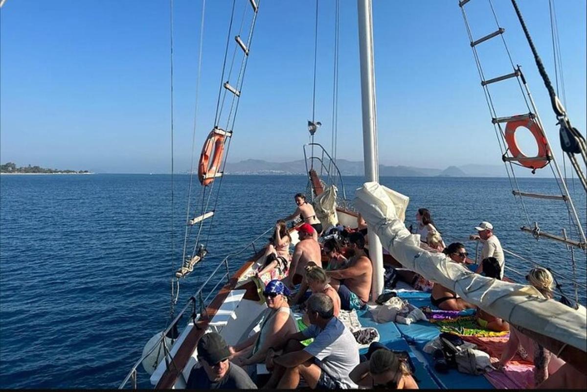 a group of people on a boat in the water