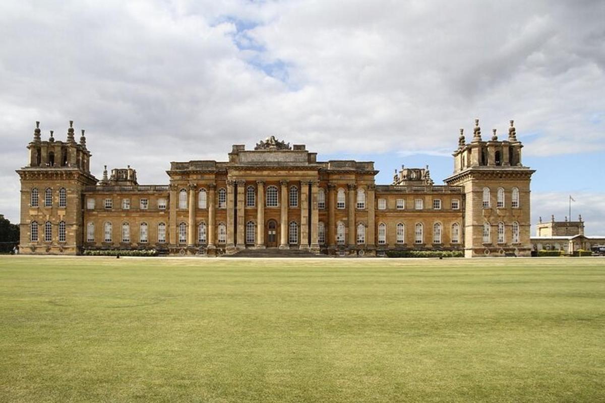 a large building with a large field in front of it