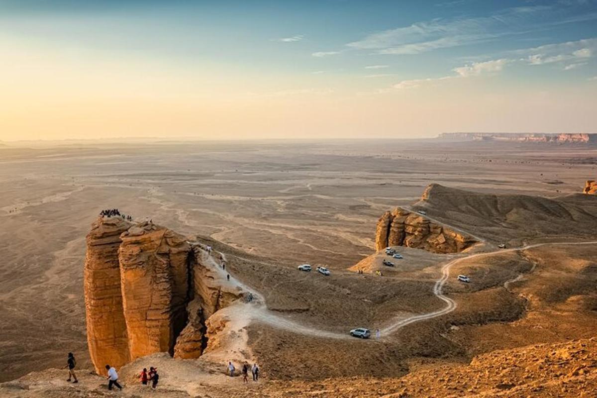 a group of people standing on top of a mountain