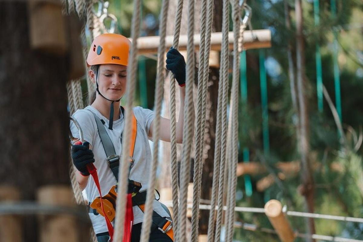 a person is climbing on a rope bridge
