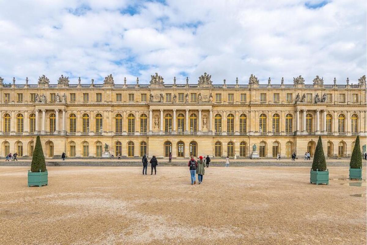 people standing in front of a large building