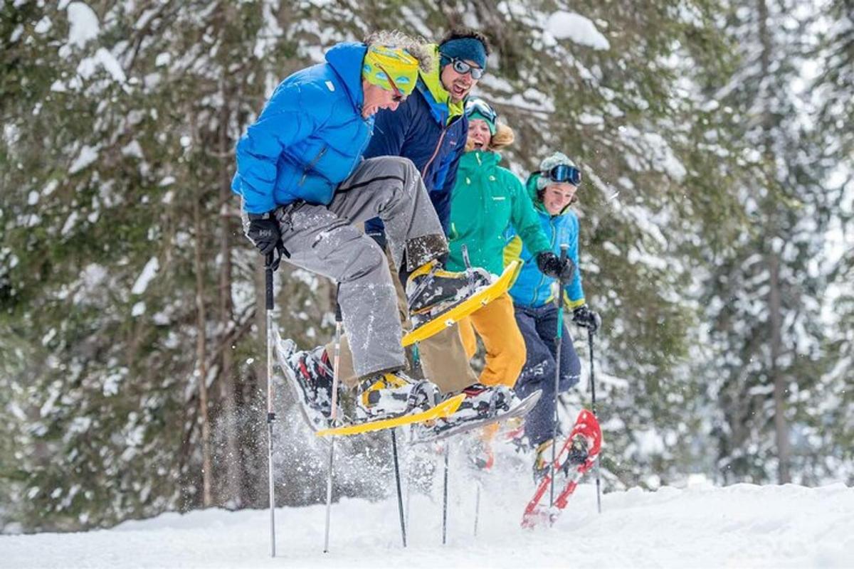 a man jumping in the air in the snow