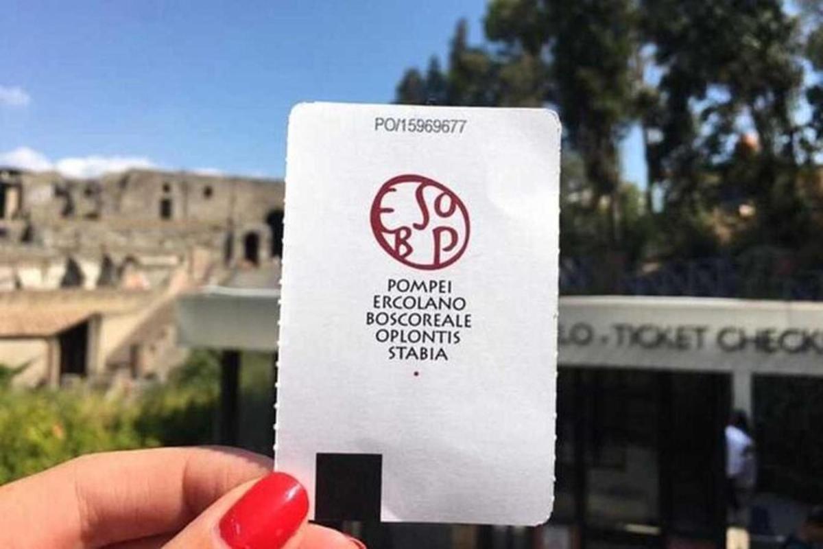 a person holding up a white card with a sign