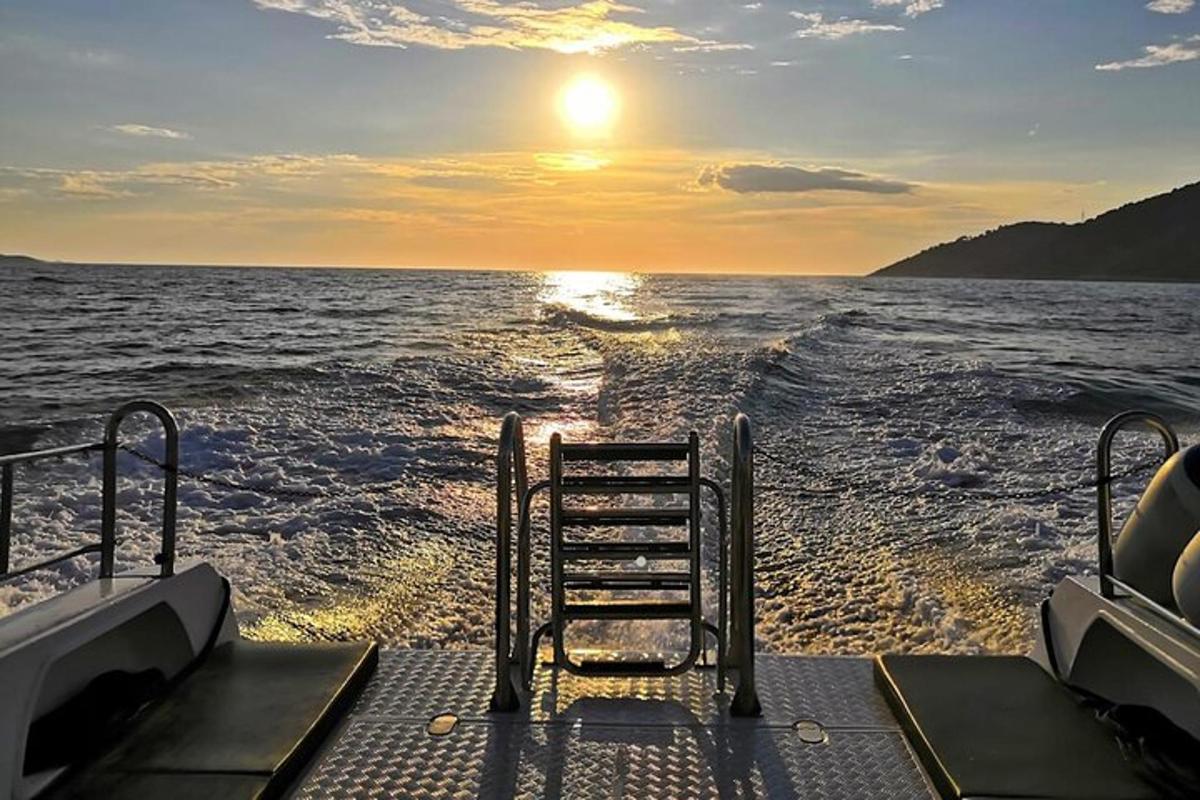 a view from the back of a boat in the water