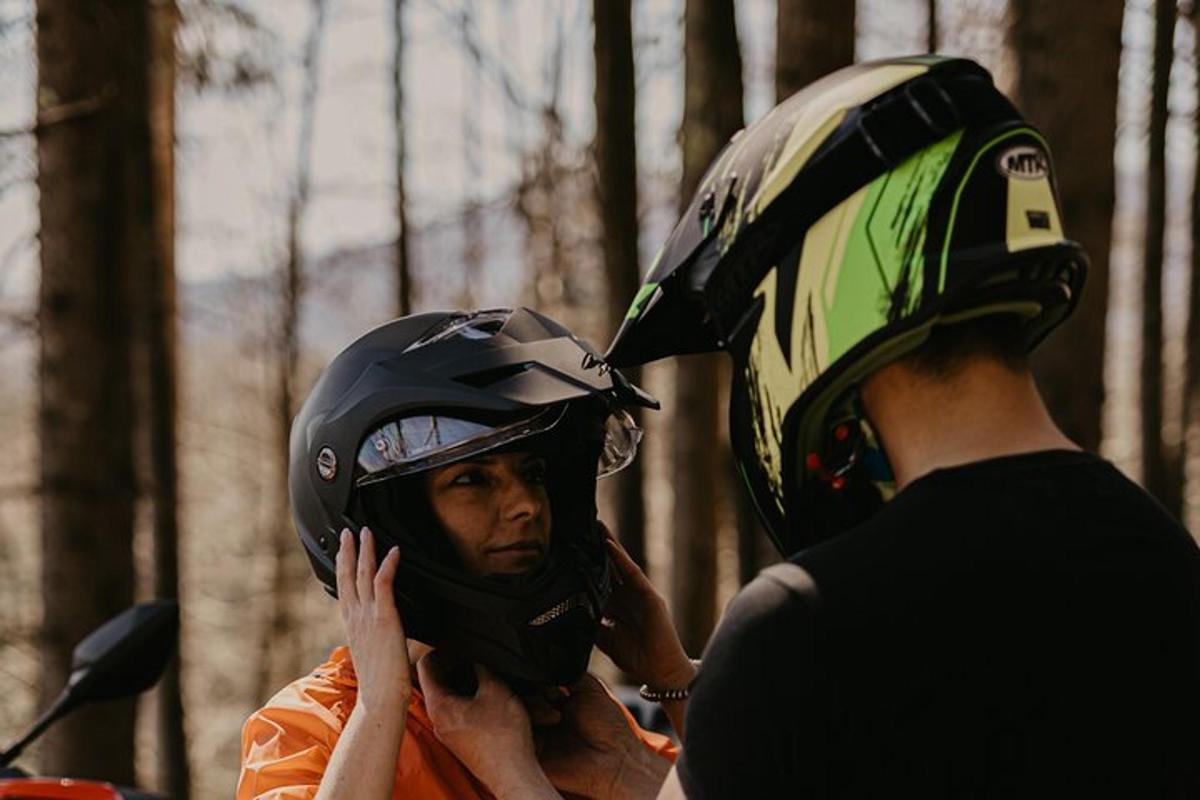 a man is wearing a helmet on a motorcycle