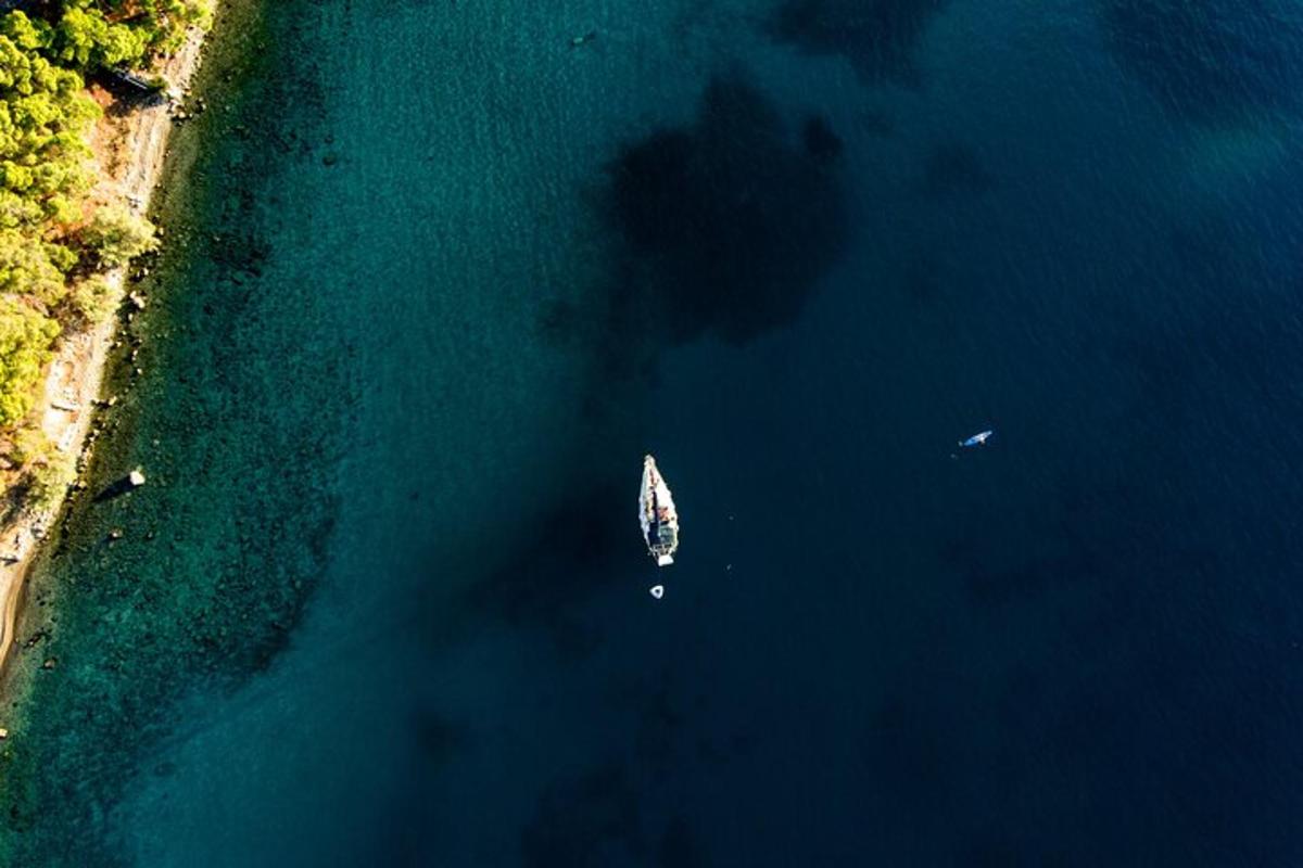 an aerial view of a boat in the water