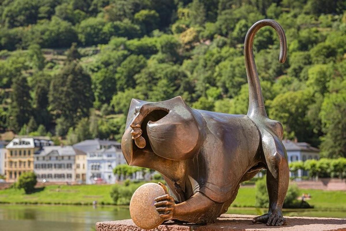 a statue of an elephant sitting on a rock