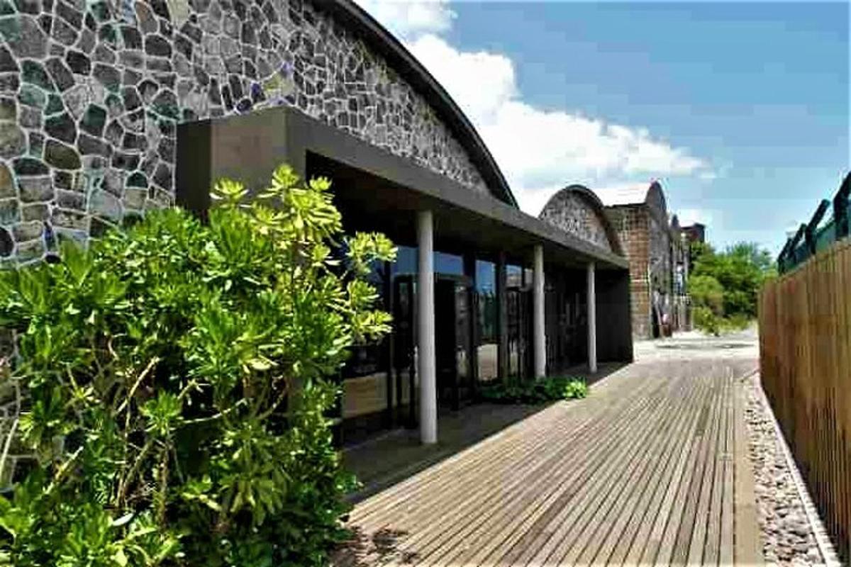 a building with a wooden boardwalk in front of it