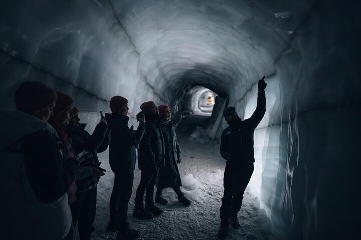 a group of people standing in a tunnel