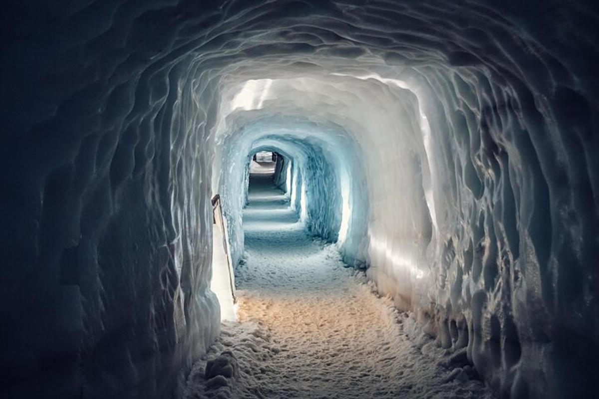 a snow tunnel with a row of stairs in it