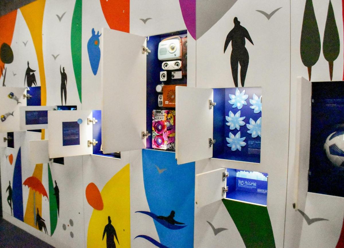a room with a wall covered in stickers