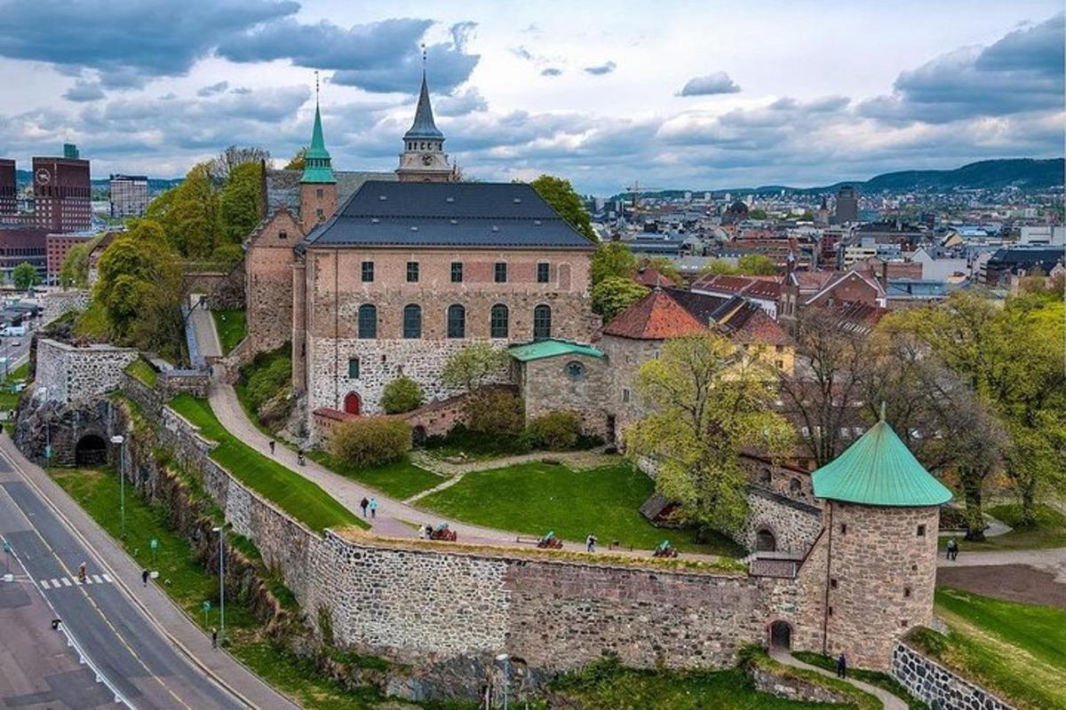 an old castle with a city in the background