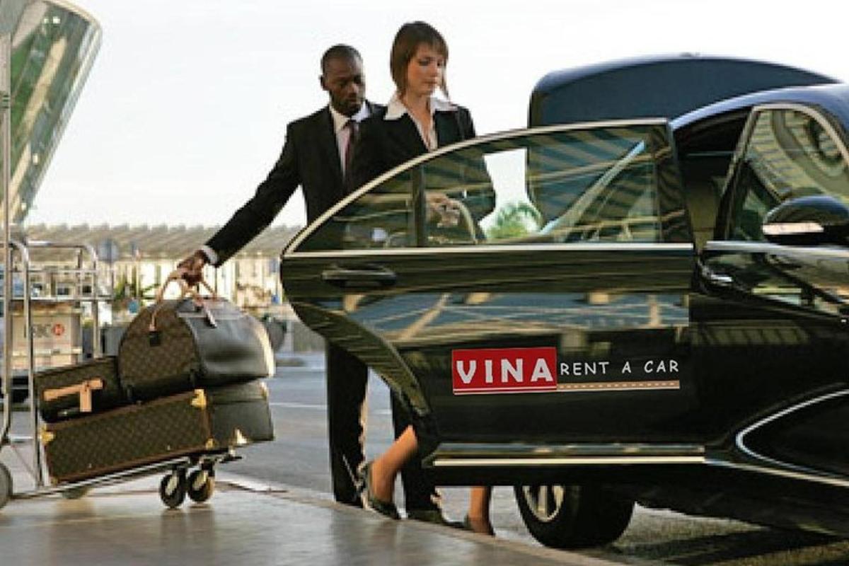 a man and a woman getting out of a car