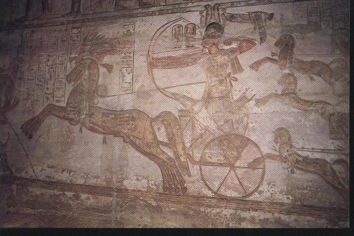 zeď s obrazem muže jedoucího v kočáře