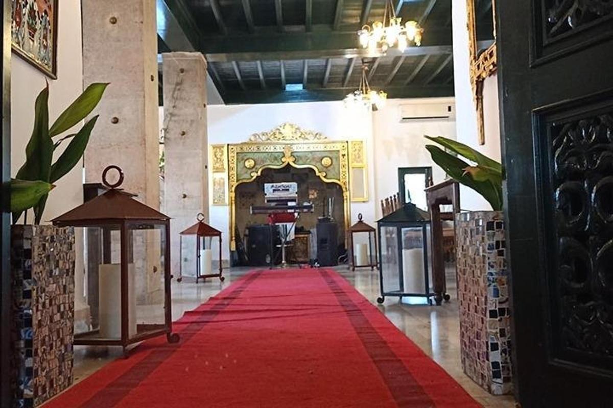 a hallway with a red carpet in a building