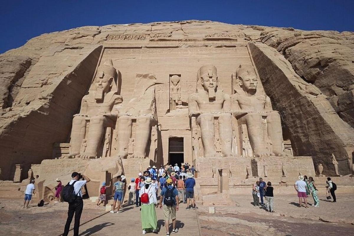 a group of people standing in front of an arch