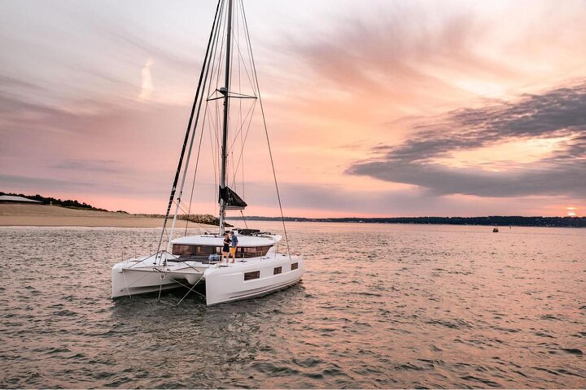 a white boat in the middle of a body of water