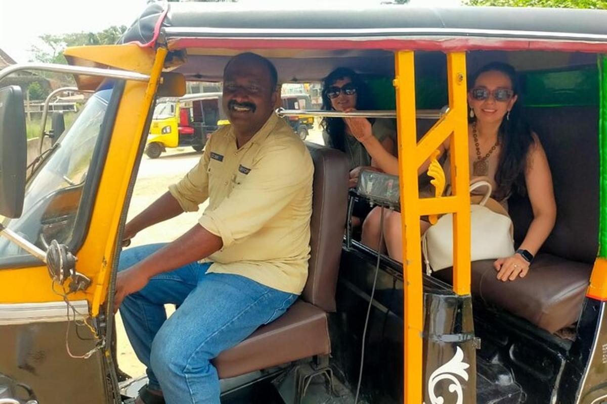 three people sitting in the back of a bus