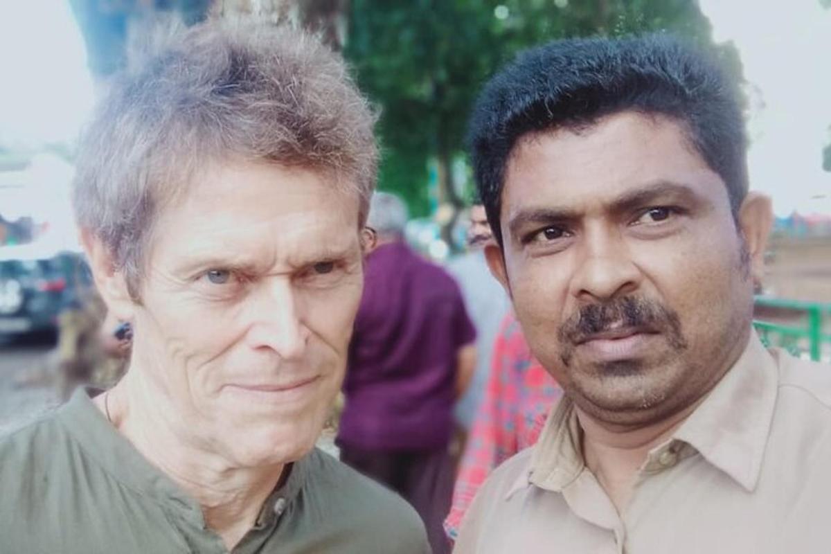 two men are standing next to each other