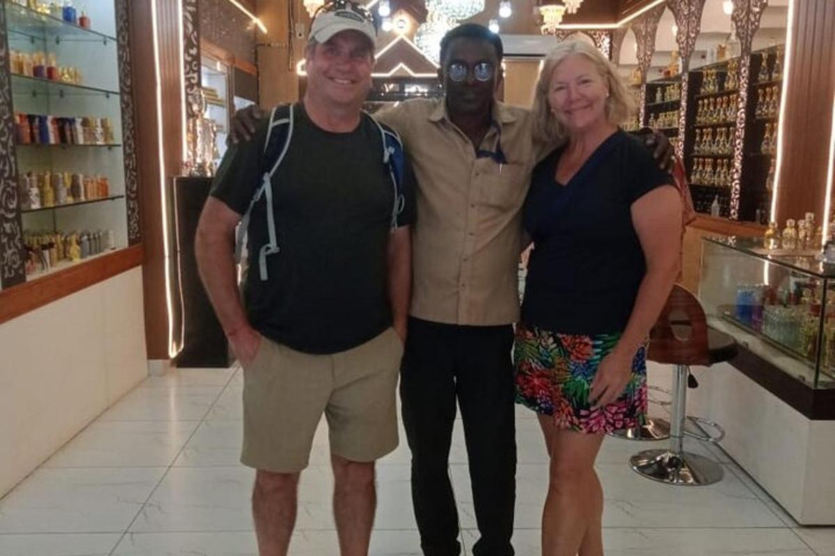 a man and a woman posing for a picture in a store