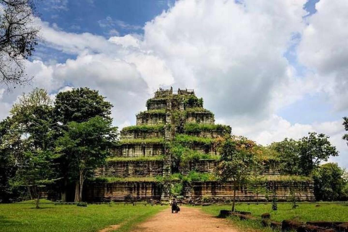 a large building in the middle of a field