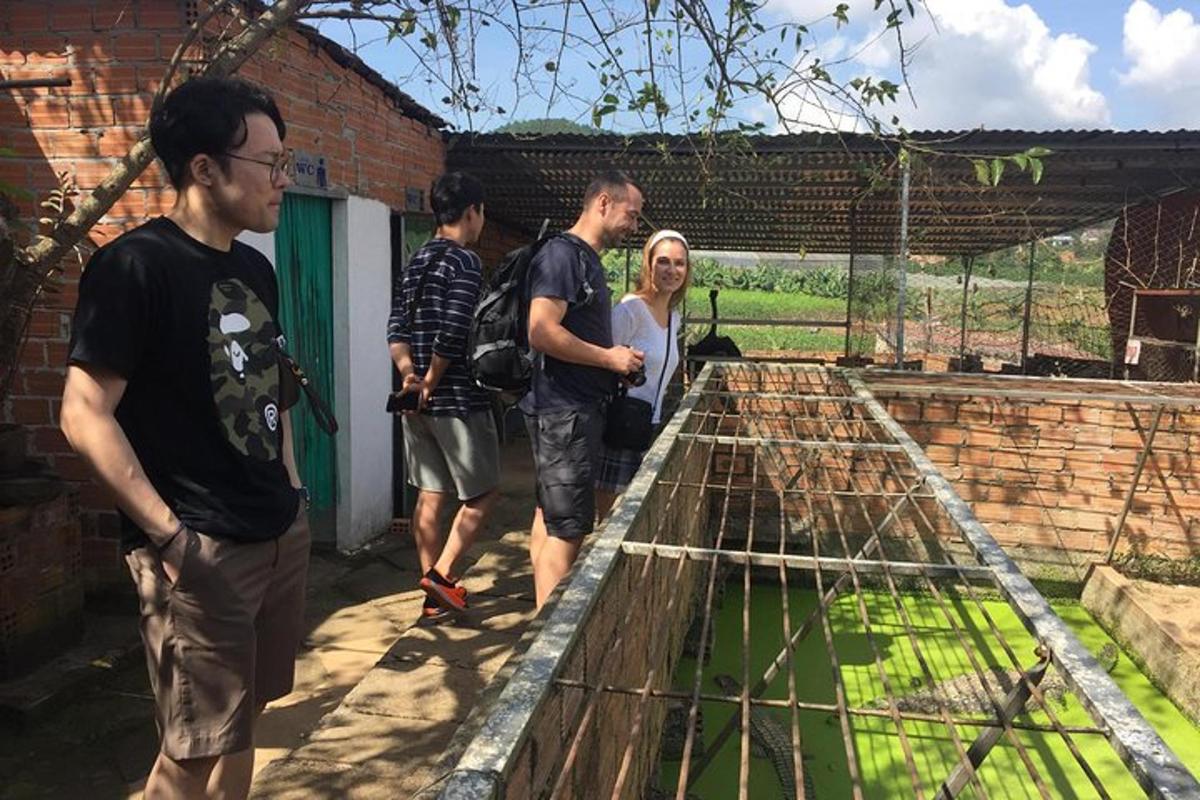 a group of people looking at a bird cage
