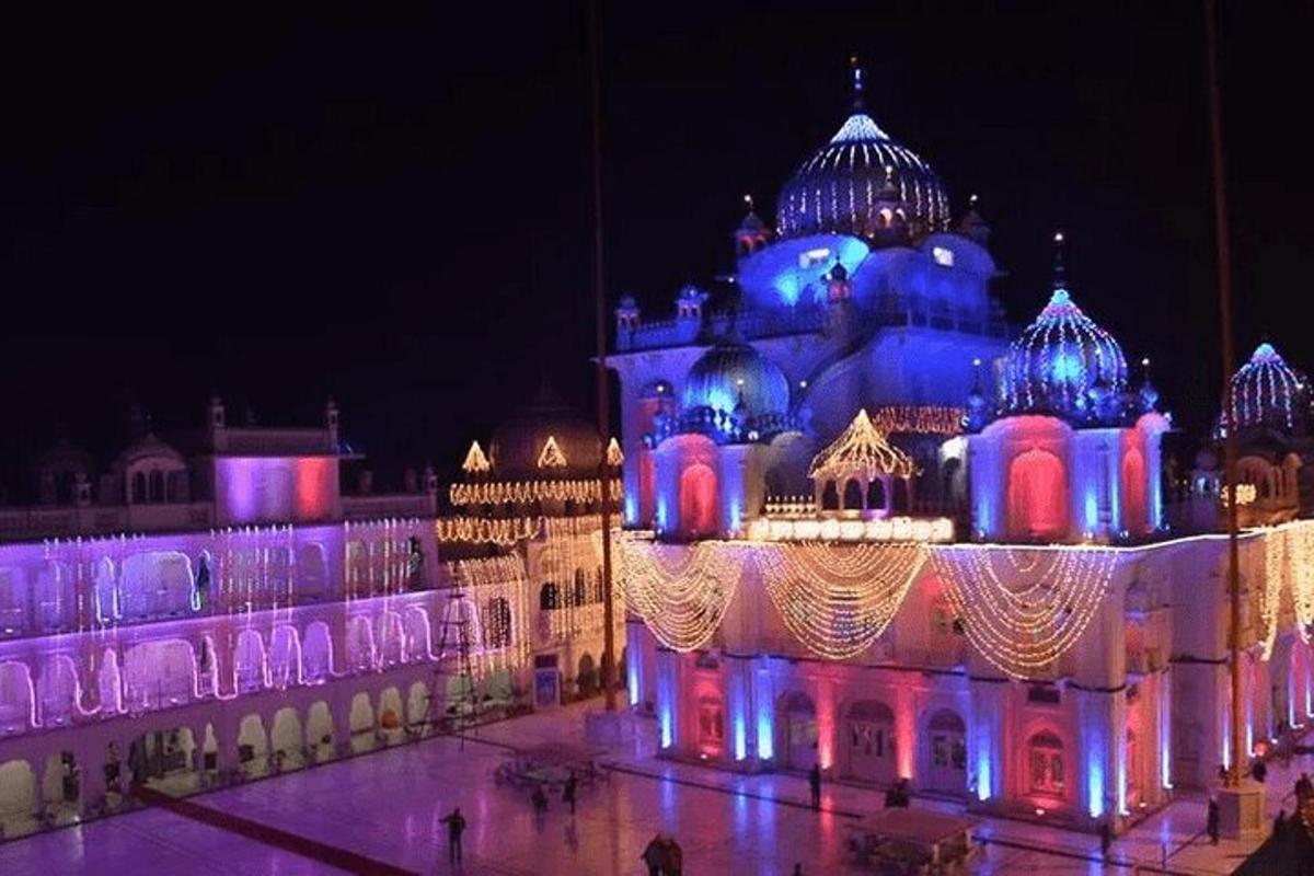 a building lit up in blue and white at night