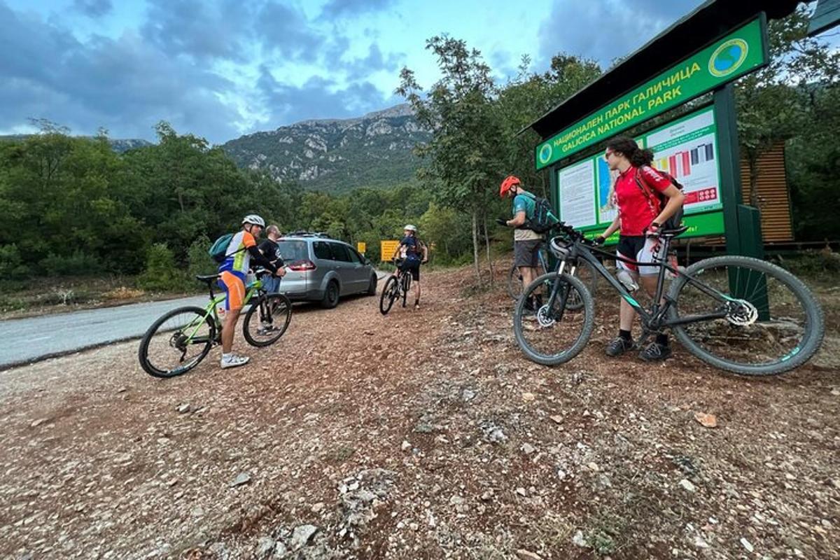 a group of people on bikes at a gas station