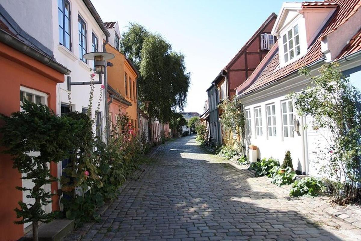 a cobblestone street in a town with buildings