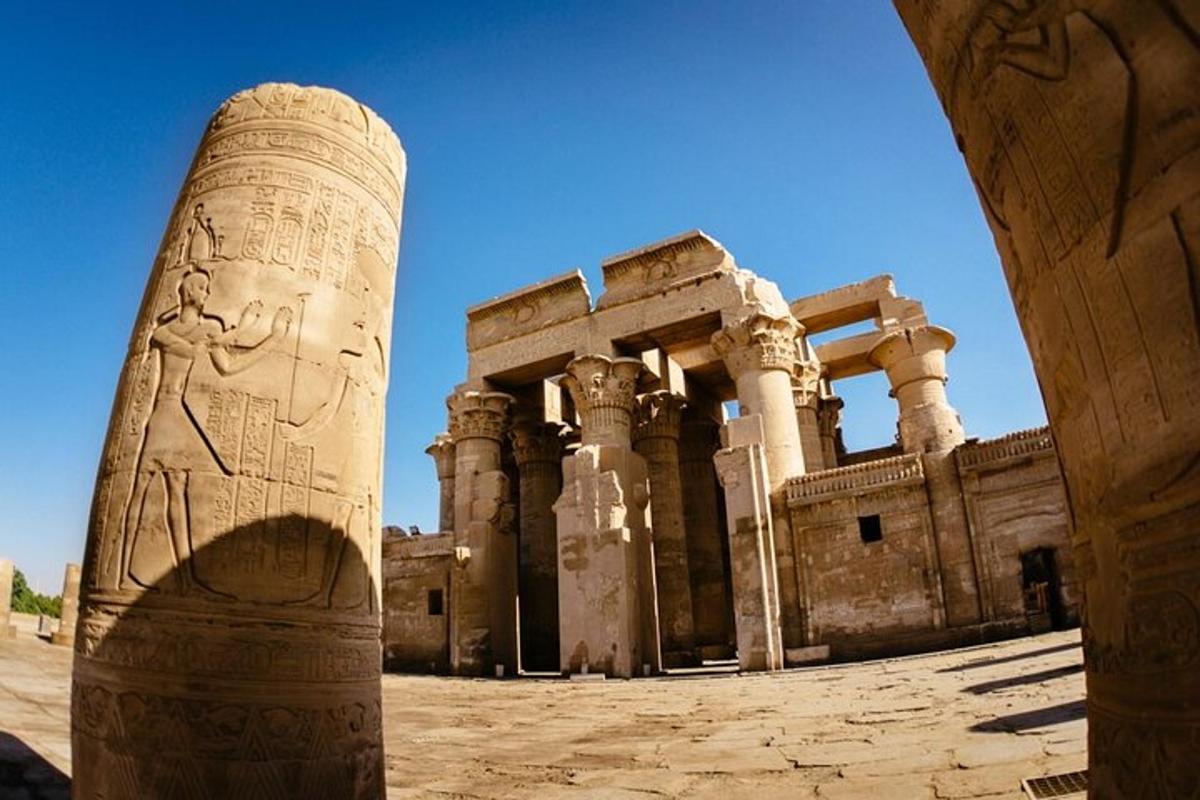 an ancient building with a pillar in front of it