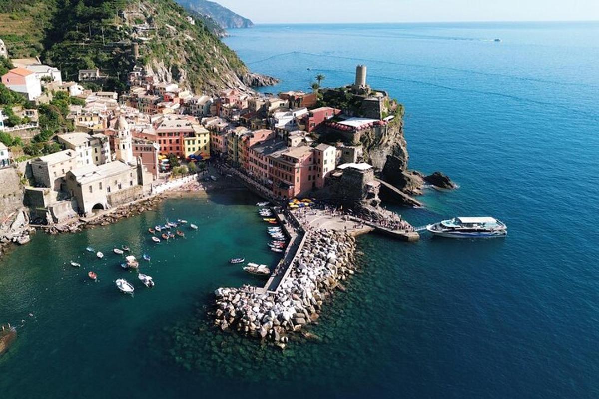 an aerial view of a town with boats in the water