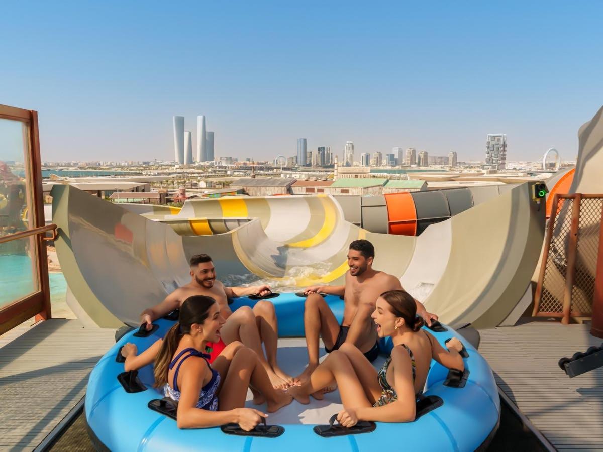 a group of people are sitting on an inflatable