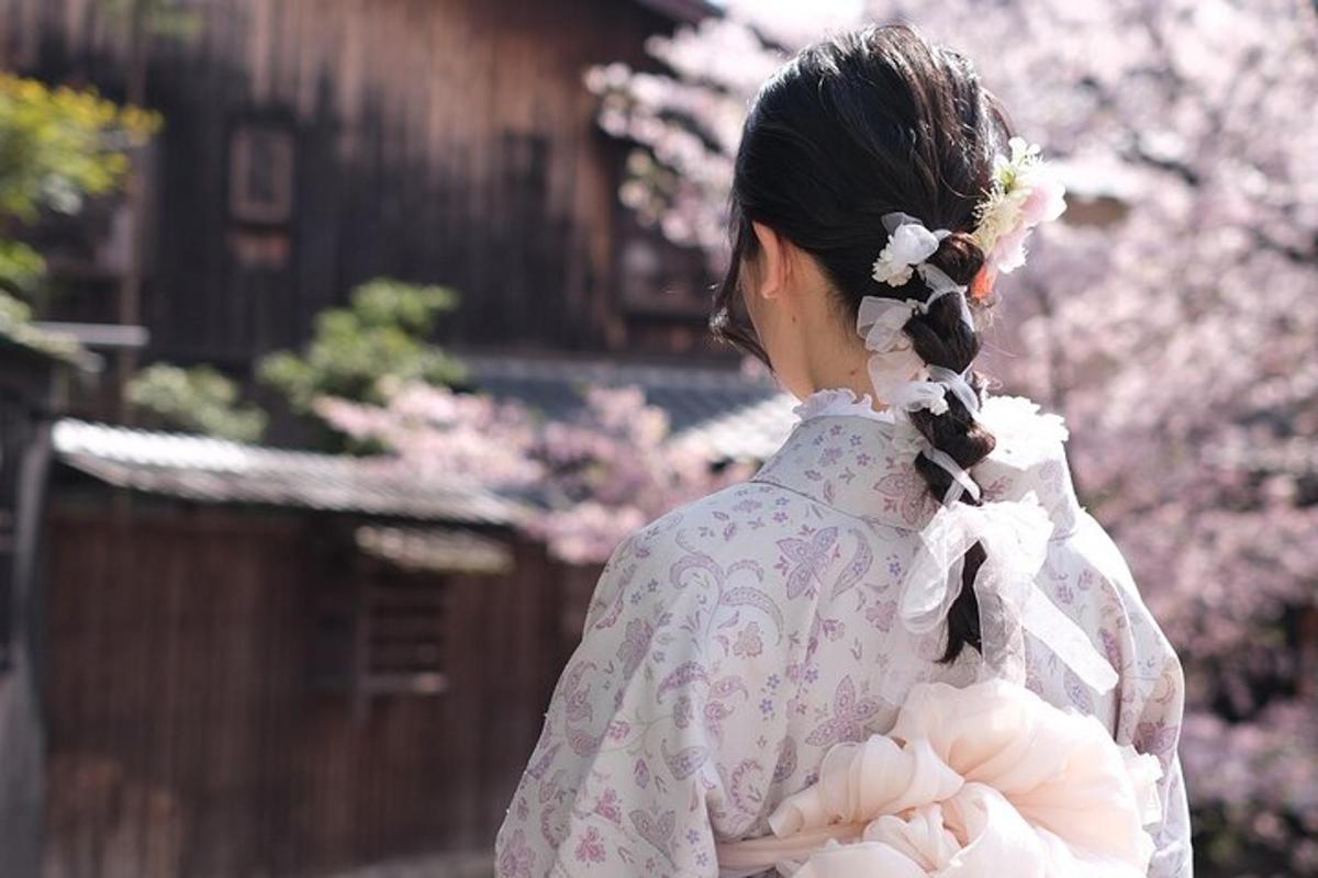 a woman in a kimono with flowers in her hair